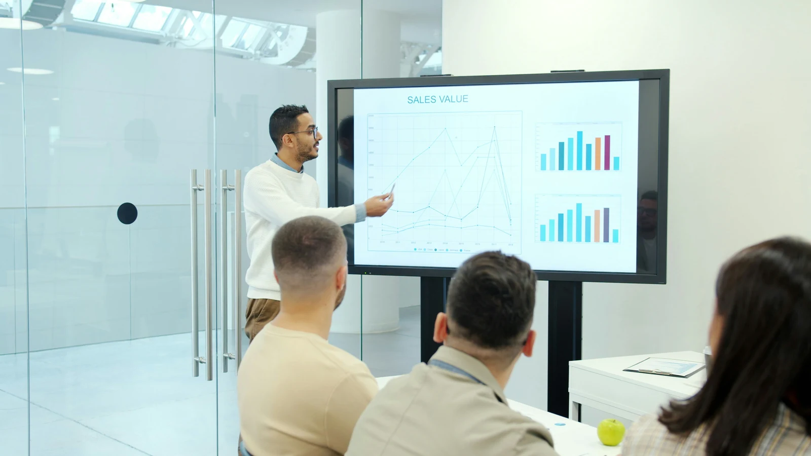 Studio owner reviewing analytics and campaign performance data