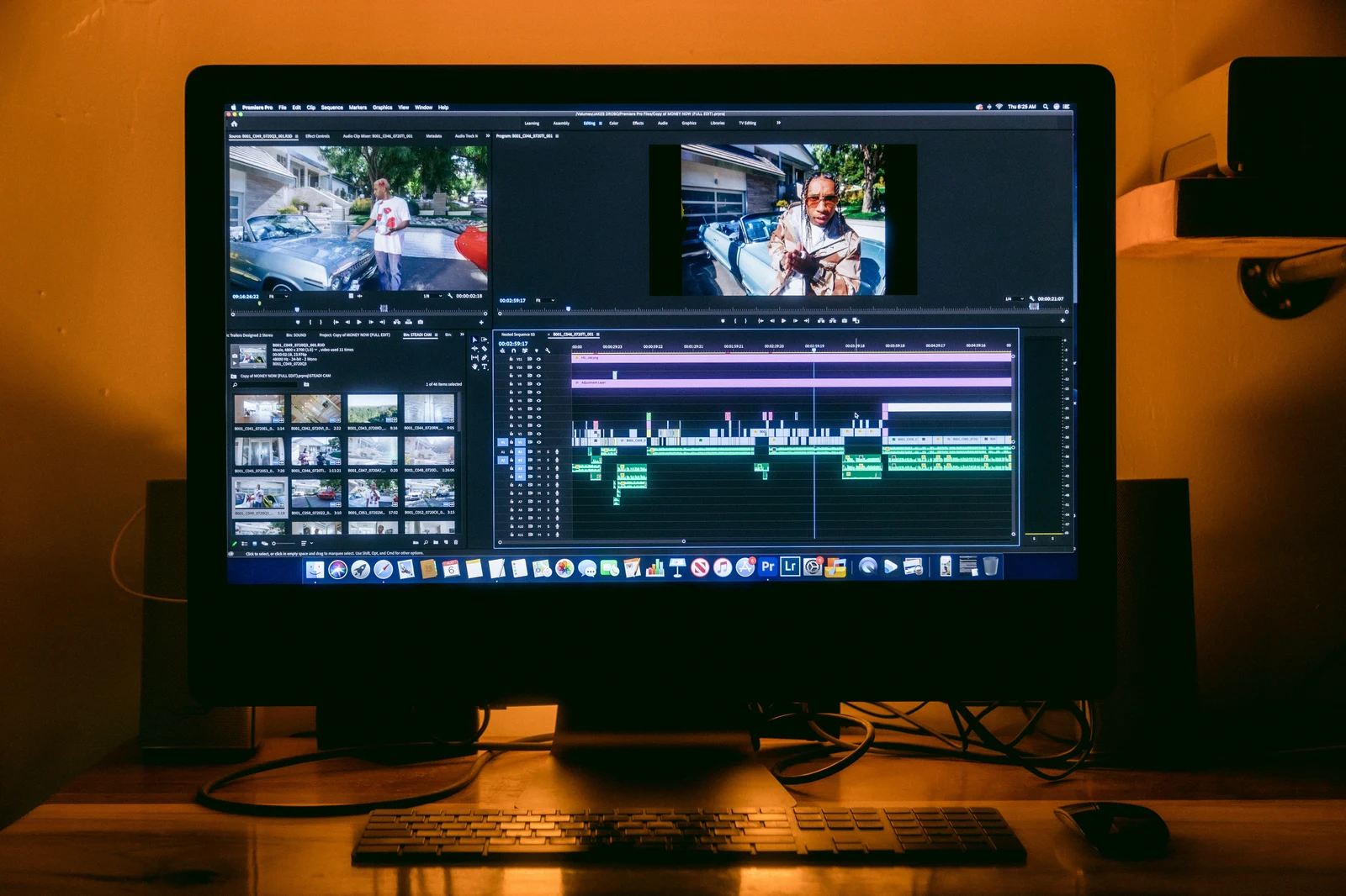 Photographer editing photos at computer workstation