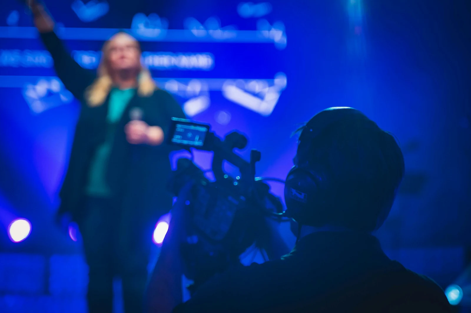 Corporate conference photography showing a large summit in session