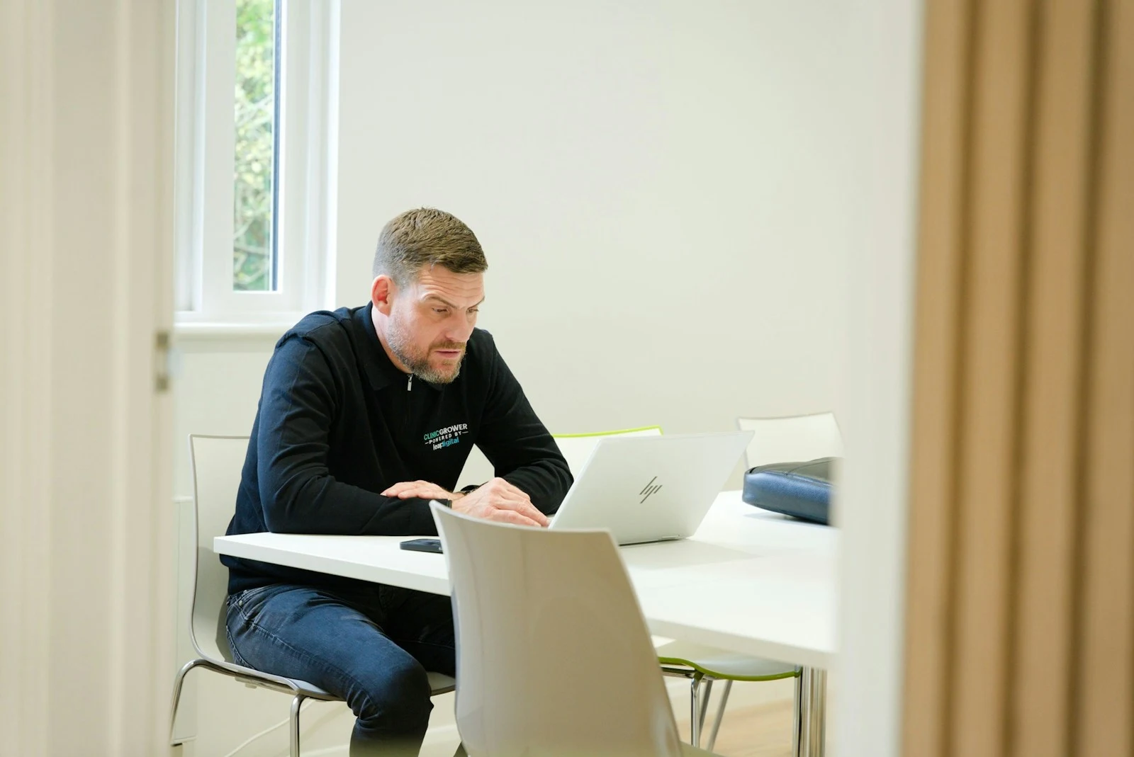 Photographer planning Meta ad campaigns on laptop — Lead Gen vs Traffic Ads strategy