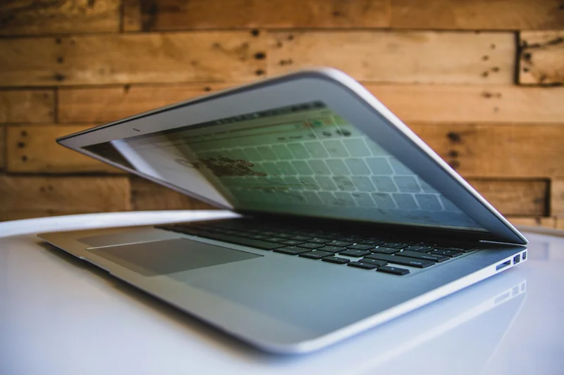 Photographer reviewing paid ad campaign results on laptop
