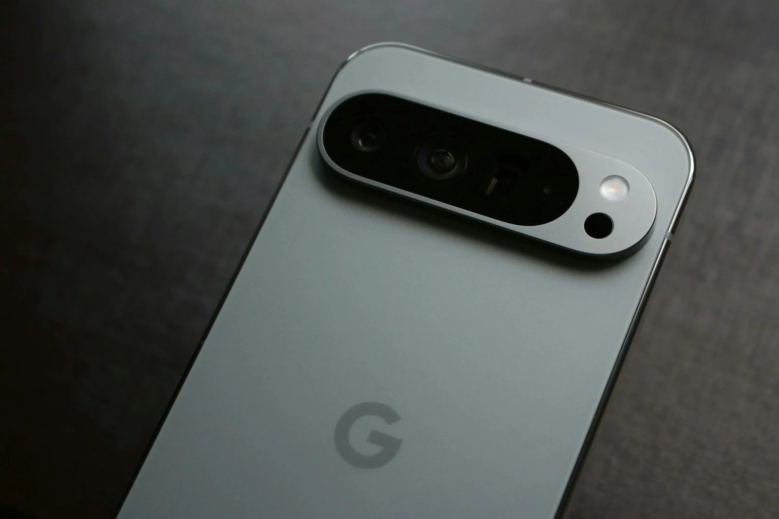 Close-up of phone showing Google reviews for a photography business